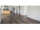 Open-concept living and kitchen area featuring laminate floors, modern finishes, and an airy atmosphere at 802 N Tuxedo St, Indianapolis, IN 46201
