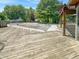 A wooden deck and covered pool in the backyard area, a great area for activities at 812 Timber Creek Dr, Indianapolis, IN 46239