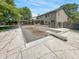 A backyard with a pool, a wooden deck, and a wooden canopy at 812 Timber Creek Dr, Indianapolis, IN 46239