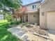 Charming two-story home with brick and vinyl siding, a well-manicured lawn, and a colorful red Japanese maple tree at 812 Timber Creek Dr, Indianapolis, IN 46239