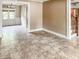 Open-concept living room with tile flooring leading to a dining area and staircase, creating a spacious feel at 812 Timber Creek Dr, Indianapolis, IN 46239