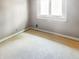 Room featuring light-colored walls, a window for natural light and bright floors ready for renovation at 812 Timber Creek Dr, Indianapolis, IN 46239