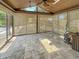 Enclosed sun room with tile floors and a wood beamed roof with lots of sunlight at 812 Timber Creek Dr, Indianapolis, IN 46239