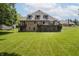 Brick home featuring a walkout basement and back deck overlooking the lawn at 815 Copperfield Ln, Danville, IN 46122
