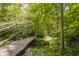 View of a bridge and creek located at the edge of the backyard at 815 Copperfield Ln, Danville, IN 46122