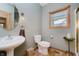 Charming bathroom with stylish fixtures, vanity, and natural light from the window at 815 Copperfield Ln, Danville, IN 46122