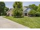 Inviting two-story home featuring a well-manicured lawn and beautiful mature trees offering great curb appeal at 815 Copperfield Ln, Danville, IN 46122