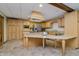 Spacious kitchen with stainless steel appliances, granite countertops, an island, and wood cabinets at 815 Copperfield Ln, Danville, IN 46122