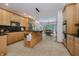 Bright kitchen boasts modern cabinetry, granite counters, and a center island with pendant lighting and views to an eat-in kitchen at 815 Copperfield Ln, Danville, IN 46122