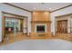 Bright living room featuring a cozy fireplace, hardwood floors and an open layout at 815 Copperfield Ln, Danville, IN 46122