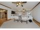 Bright living room features custom built-ins, three ceiling fans, and plush white furniture at 815 Copperfield Ln, Danville, IN 46122
