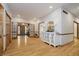 Spacious living room featuring hardwood floors, stylish console table and entry to the home's foyer at 815 Copperfield Ln, Danville, IN 46122