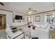 Cozy living room with white furnishings, stylish décor, built-in shelving, and a large window with natural light at 815 Copperfield Ln, Danville, IN 46122
