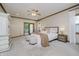 Inviting main bedroom with neutral tones, access to a balcony, and plush carpeting at 815 Copperfield Ln, Danville, IN 46122