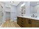 Bathroom boasts a double vanity, modern fixtures, and sleek tile flooring at 8355 Fieldfare Way, Indianapolis, IN 46237