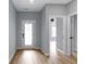 Inviting entryway with light blue walls and view to the living area at 8355 Fieldfare Way, Indianapolis, IN 46237
