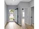 Entryway featuring a storm door and a view into the house and the neighborhood at 8355 Fieldfare Way, Indianapolis, IN 46237