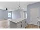 Spacious open-concept kitchen showcasing a white island counter with sleek black hardware at 8355 Fieldfare Way, Indianapolis, IN 46237