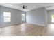 Spacious living room with wood-look floors and ample natural light at 8355 Fieldfare Way, Indianapolis, IN 46237
