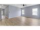 Sunlit living room with wood-look floors and neutral paint offers space and comfort at 8355 Fieldfare Way, Indianapolis, IN 46237
