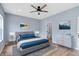 Serene main bedroom with ceiling fan, hardwood floors, and natural light at 8355 Fieldfare Way, Indianapolis, IN 46237