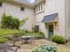 A beautiful outdoor patio with a green door and a seating area at 9399 Irishmans Run Ln, Zionsville, IN 46077