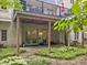 Outdoor patio with a raised deck, lush greenery, and privacy at 9399 Irishmans Run Ln, Zionsville, IN 46077