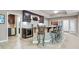 Entertainer's bar area featuring dark wood cabinets and tiled bar, with seating at 9399 Irishmans Run Ln, Zionsville, IN 46077
