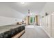 Cozy bedroom with vaulted ceilings, a seating area, and ample storage at 9399 Irishmans Run Ln, Zionsville, IN 46077