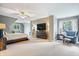 Spacious bedroom with a ceiling fan, large TV, and comfortable furnishings at 9399 Irishmans Run Ln, Zionsville, IN 46077