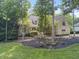 Charming two-story home with a well-maintained front yard and beautiful mature trees at 9399 Irishmans Run Ln, Zionsville, IN 46077