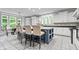 Eat-in kitchen with breakfast bar seating, white cabinetry, and backyard views at 9399 Irishmans Run Ln, Zionsville, IN 46077
