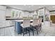 Kitchen featuring a central island with pendant lights, white cabinetry, and stainless steel appliances at 9399 Irishmans Run Ln, Zionsville, IN 46077