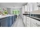 Kitchen featuring a central island with pendant lights, black granite countertops, and stainless steel appliances at 9399 Irishmans Run Ln, Zionsville, IN 46077