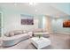 Modern living room with a light blue walls, plush sofas, and artistic decor at 9399 Irishmans Run Ln, Zionsville, IN 46077