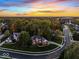 Aerial view of a home nestled in a lush neighborhood with mature trees and scenic surroundings at 9703 Fortune Dr, Fishers, IN 46037