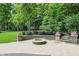 Paver patio with fire pit feature and landscaping at 9703 Fortune Dr, Fishers, IN 46037