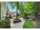 Beautiful outdoor space with brick patio, fire pit, and lush landscaping at 9703 Fortune Dr, Fishers, IN 46037