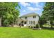 Expansive backyard featuring a lush lawn, patio, and beautifully landscaped garden beds, ideal for outdoor living at 9703 Fortune Dr, Fishers, IN 46037