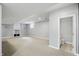 Finished basement with carpet, a wet bar and an adjacent bathroom at 9703 Fortune Dr, Fishers, IN 46037