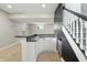 Finished basement featuring a wet bar, carpeted floors and a staircase at 9703 Fortune Dr, Fishers, IN 46037