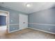 Bedroom with neutral decor, closet and view of the hallway and staircase at 9703 Fortune Dr, Fishers, IN 46037