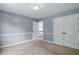 Well-lit bedroom featuring closet, trim and view of the stairwell at 9703 Fortune Dr, Fishers, IN 46037