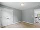 Simple bedroom with a closet for storage and adjacent view of the staircase at 9703 Fortune Dr, Fishers, IN 46037