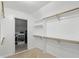 Well-organized walk-in closet featuring shelving and rods for optimal storage and organization at 9703 Fortune Dr, Fishers, IN 46037