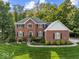 Lovely brick home featuring a neatly landscaped front yard and classic architectural details at 9703 Fortune Dr, Fishers, IN 46037