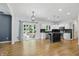 Open-concept kitchen with stainless steel appliances, modern cabinets, and a center island with backyard views at 9703 Fortune Dr, Fishers, IN 46037