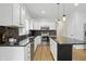 Well-lit kitchen with stainless steel appliances, center island, and ample counter space at 9703 Fortune Dr, Fishers, IN 46037