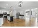 Spacious eat-in kitchen with stainless steel appliances, modern island, and hardwood floors at 9703 Fortune Dr, Fishers, IN 46037