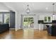 Open-concept kitchen features backyard views, stainless steel appliances, modern cabinets and convenient access to the living room at 9703 Fortune Dr, Fishers, IN 46037